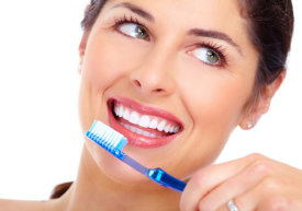 smiling beautiful woman holding a toothbrush
