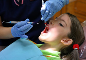 dentist doing surgery for the teeth